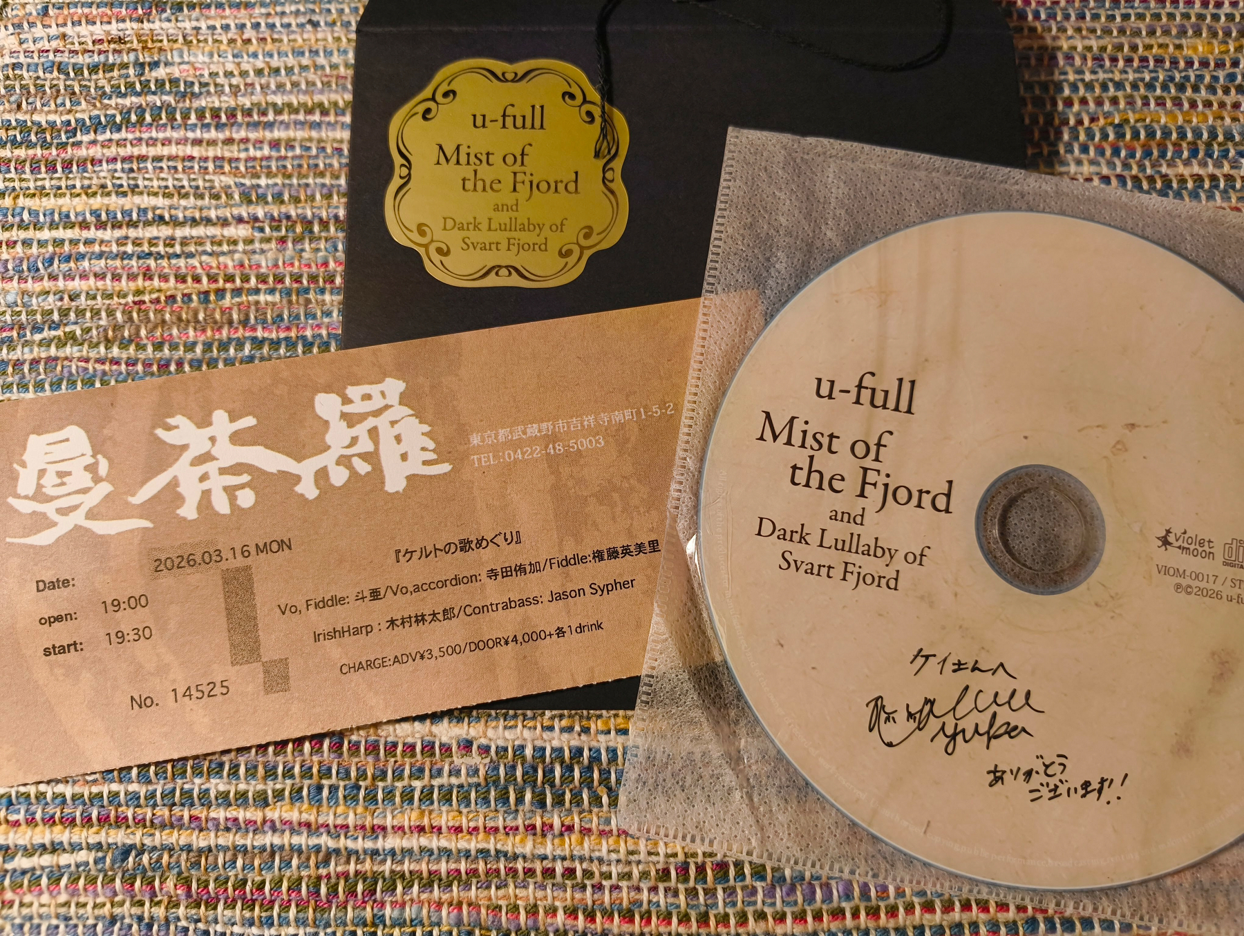 Auto-generated description: CDとチケットが並んでおり、アルバムのタイトルは「Mist of the Fjord」と書かれている。